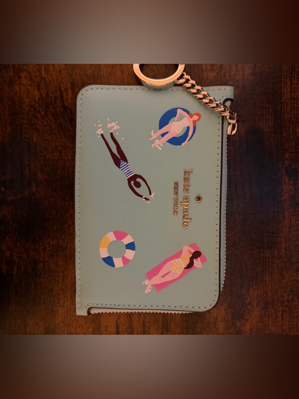 kate spade mint wristlet with colorful pool graphics